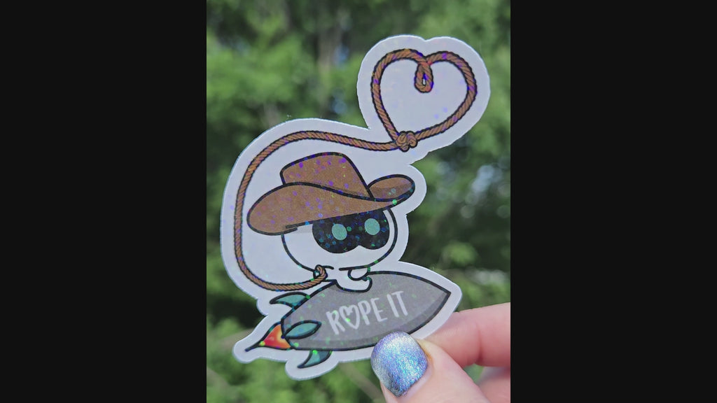 Rope IT!! BTS Jin-inspired sticker featuring Cowboy Wootteo lassoing up some love.